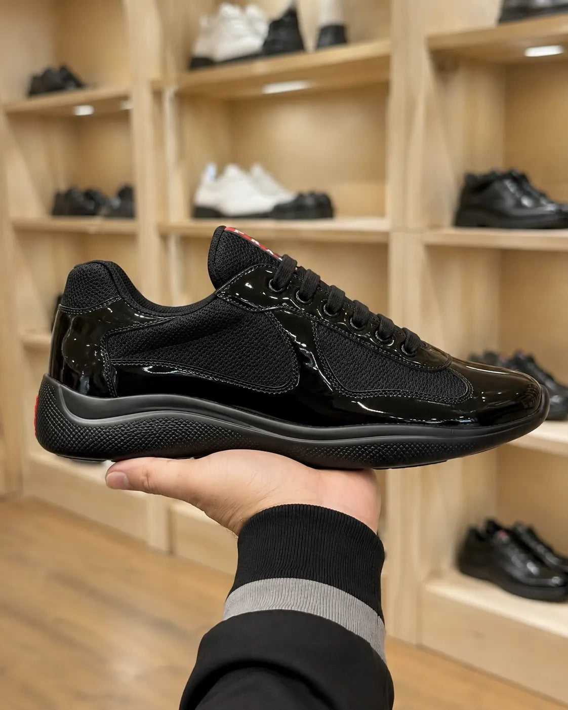 Prada America’s Cup Black Patent Trainers